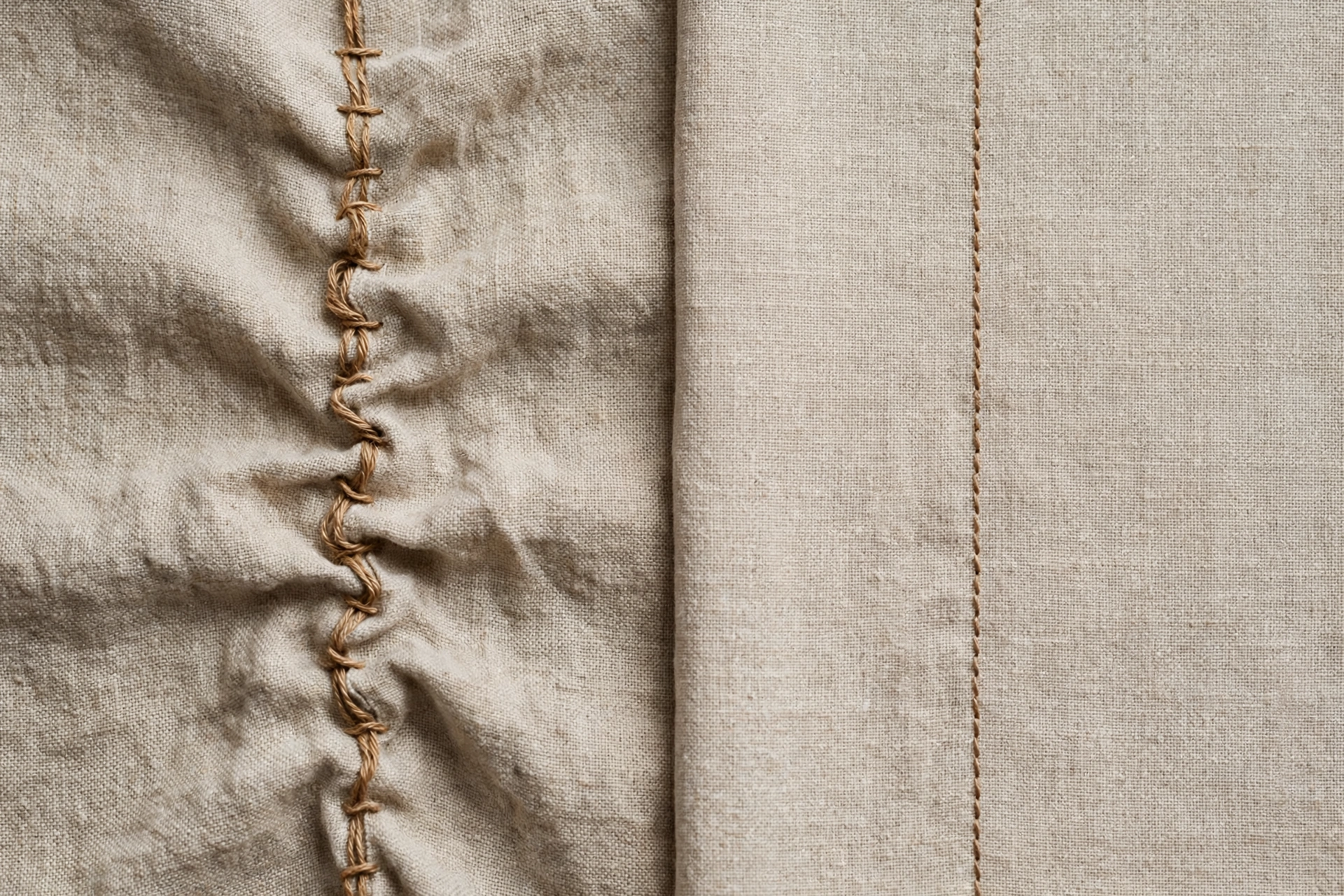 Side-by-side comparison of uneven puckered stitches and smooth even stitches on two linen swatches